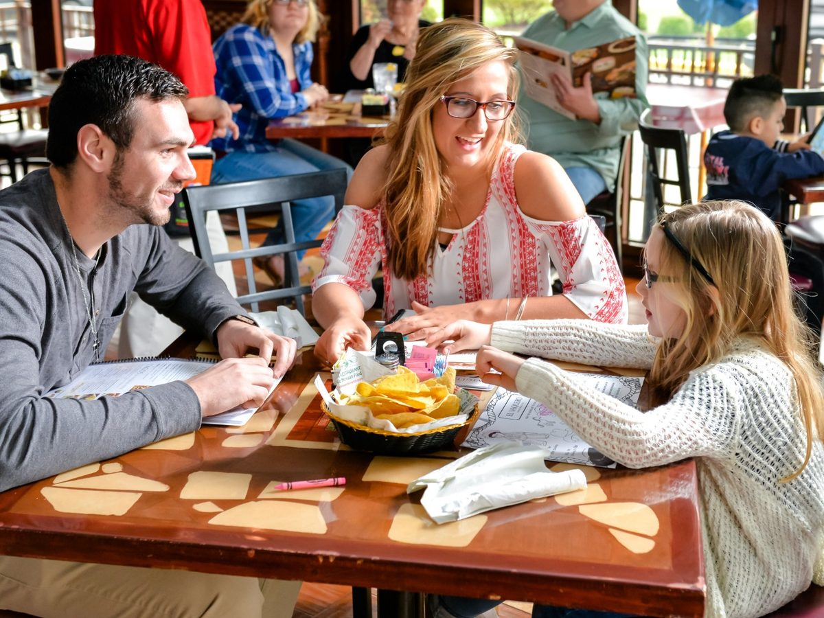 Family sharing a meal together at El Vaquero